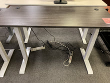 Load image into Gallery viewer, Used electric standing desk with gray laminate top and white frame