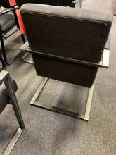 Load image into Gallery viewer, Back view of brown tufted guest chair showing gunmetal sled base