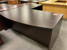 Load image into Gallery viewer, Bow front of espresso L-shaped desk with cord grommets