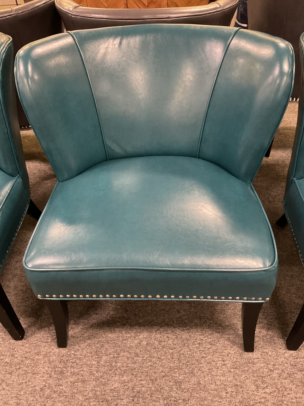 R55 Teal Leather Accent Used Chair $299.98